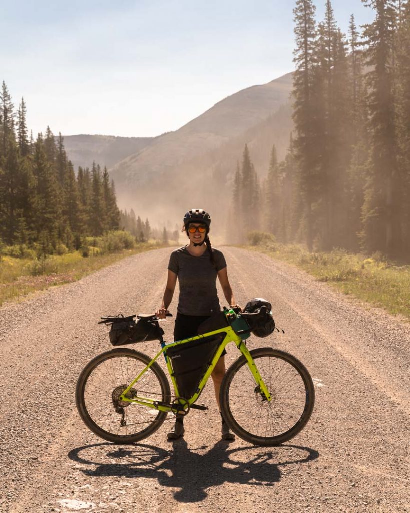 Sarah Hornby poses with the 2020 Salsa Cuttroat bicycle during a mid-summer bikepacking trip through the Canadian Rockies.